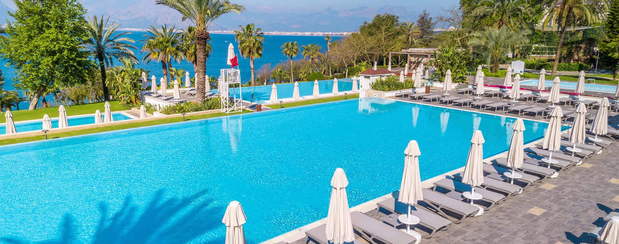 Akra Hotels Mainpage Beach And Pools Card